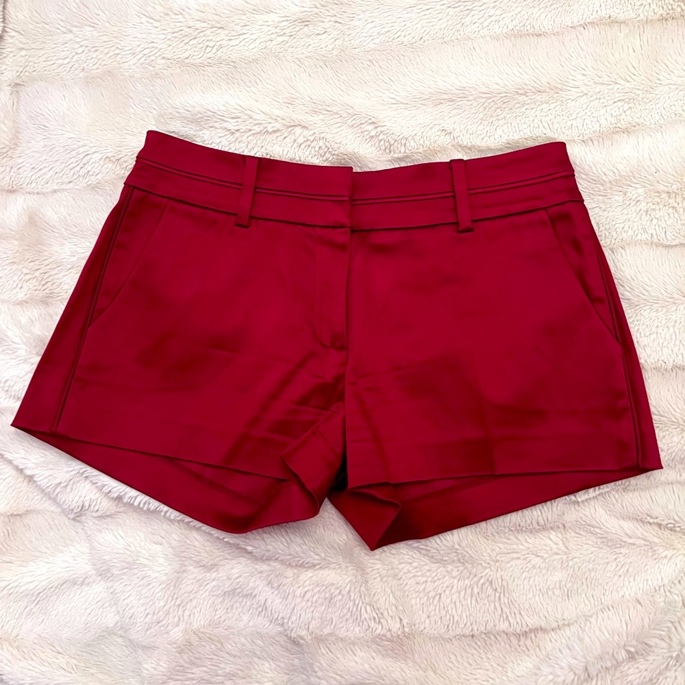 Bright red satin shorts.